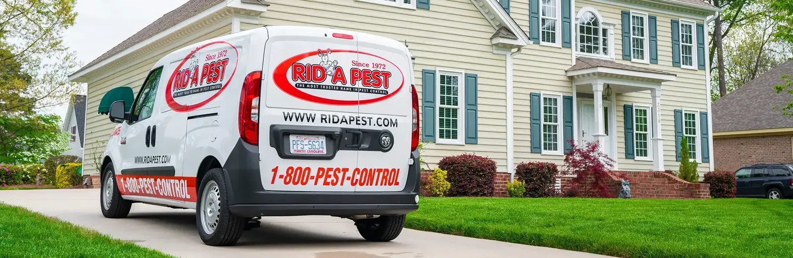 Rid-a-Pest van in front of home