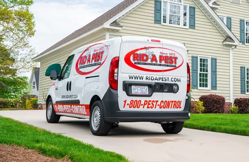 Rid-a-Pest van in front of home