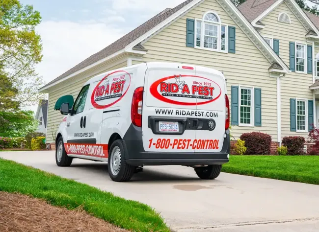 Rid-a-Pest van in front of home